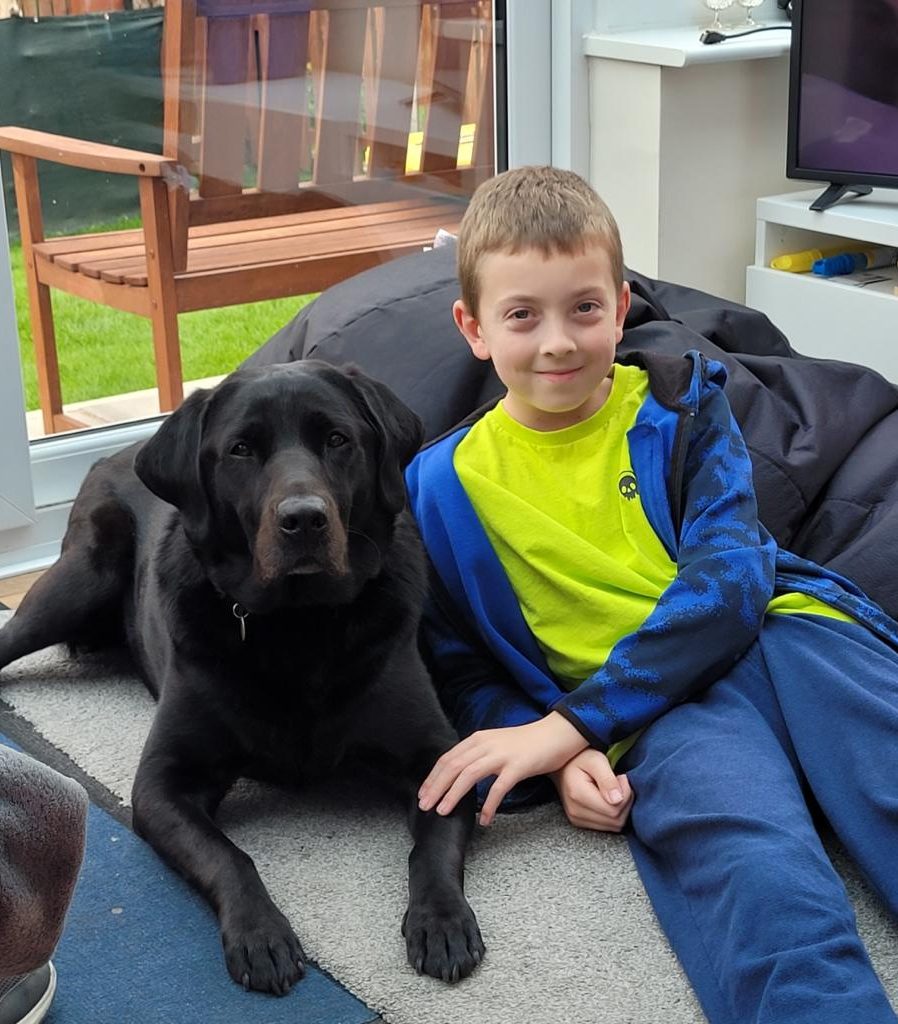 Jake sitting side-by-side with his dog Winston