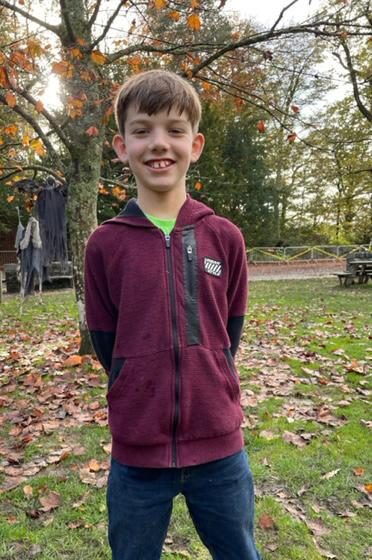 Stanley stood in a park beaming with pride